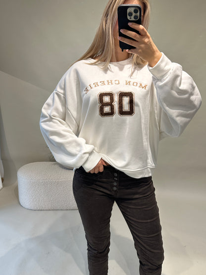Pullover in Wollweiß mit Aufschrift in Schokobraun (MON CHERIE)